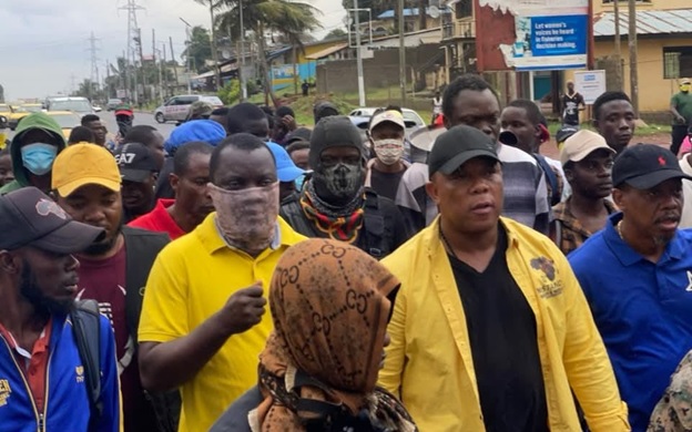 PROTESTERS LED BY MORLU AND GRAY MARCH THROUGH MONROVIA DEMANDING ACCOUNTABILITY FROM BOAKAI GOVERNMENT PROTESTERS LED BY MORLU AND GRAY MARCH THROUGH MONROVIA DEMANDING ACCOUNTABILITY FROM BOAKAI GOVERNMENT